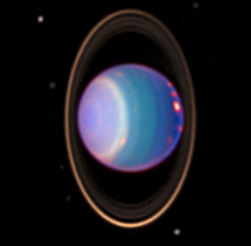 False color image of Uranus, with its rings and moons.
